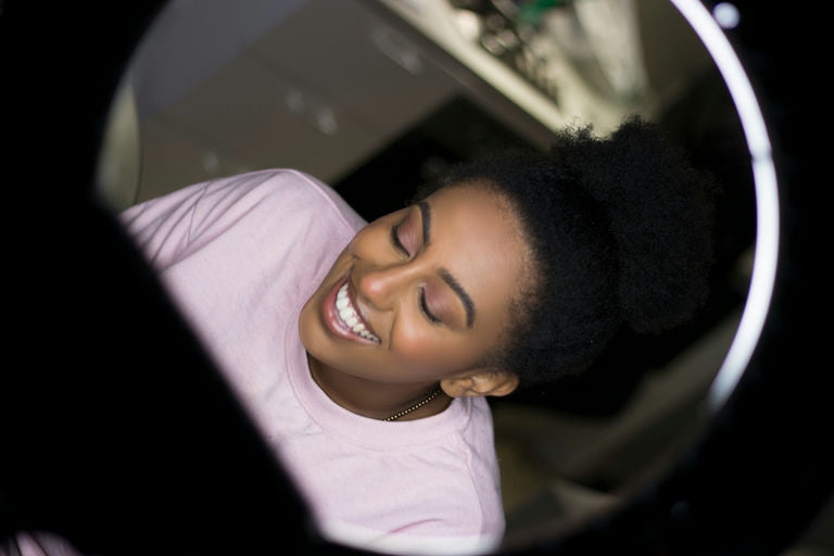 Woman using hair appliances like straighteners and curlers for styling her hair, representing hair care and beauty tips for flawless hair.