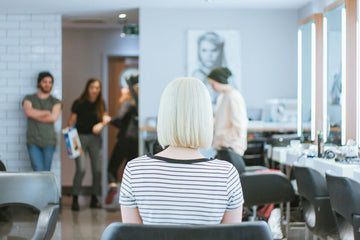 Woman demonstrating healthy and shiny hair care techniques