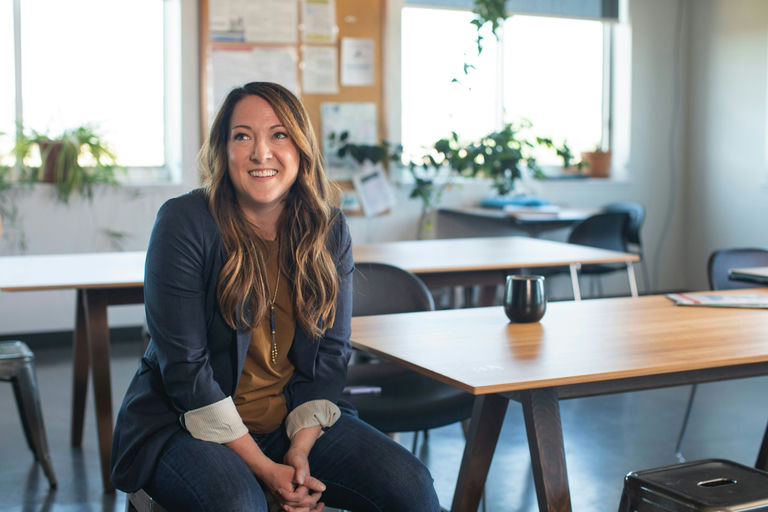 Woman with shiny, healthy hair following a comprehensive hair care routine