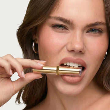 Model applying pH Glow Lipstick